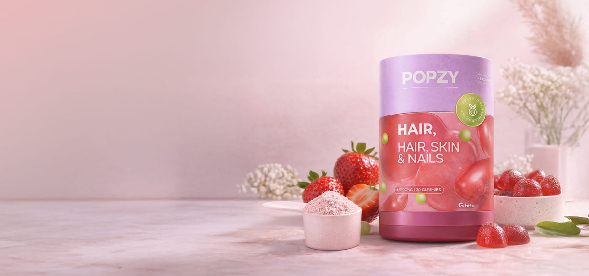 POPZY product for hair, skin, and nails with strawberries and flowers on a light background